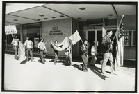 People marching with flags thumbnail