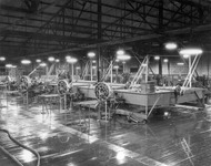 Darkened workroom with machinery. thumbnail