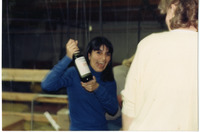 Michele Serros holding a bottle of wine thumbnail
