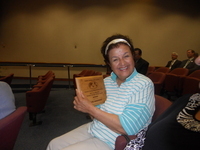 Lupe Anguiano with Climate Action Hero Award Plaque thumbnail