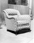 Upholstered flower patterned chair. thumbnail