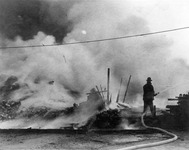 Firefighter with fire hose thumbnail