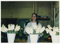 [Woman laughing behind plants] thumbnail