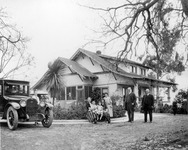 Family in front of house thumbnail