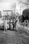 Home economic students sitting on a swing. thumbnail