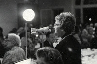 Mrs. Earl Dailey at a microphone thumbnail