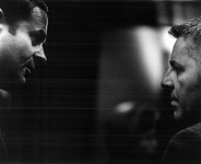 John Bunzel talking to an unknown individual. thumbnail