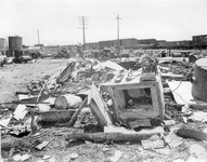 Debris and safe near railroad tracks thumbnail