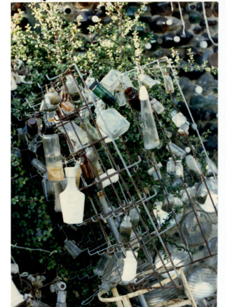Tree of Metal and White Bottles at Bottle Village thumbnail