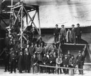 Workmen and office personnel in front of Lincoln Highway exhibit thumbnail