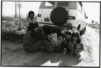 Migrant farm worker family eating lunch thumbnail