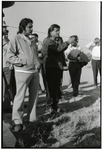 Cesar Chavez speaking (with bodyguards at his side) thumbnail