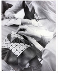 Woman hand sewing a quilt square thumbnail