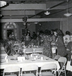 Women milling around a dining area thumbnail