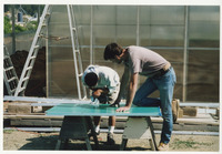 [Students working on greenhouse materials] thumbnail