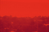 View of Key West looking west through red glass pane thumbnail