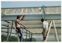 [Two students setting up greenhouse frame] thumbnail
