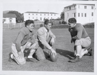 Football Coach Howie O'Daniels with Two Members of the Team [copy negative] thumbnail