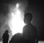 Woman viewing a bonfire thumbnail